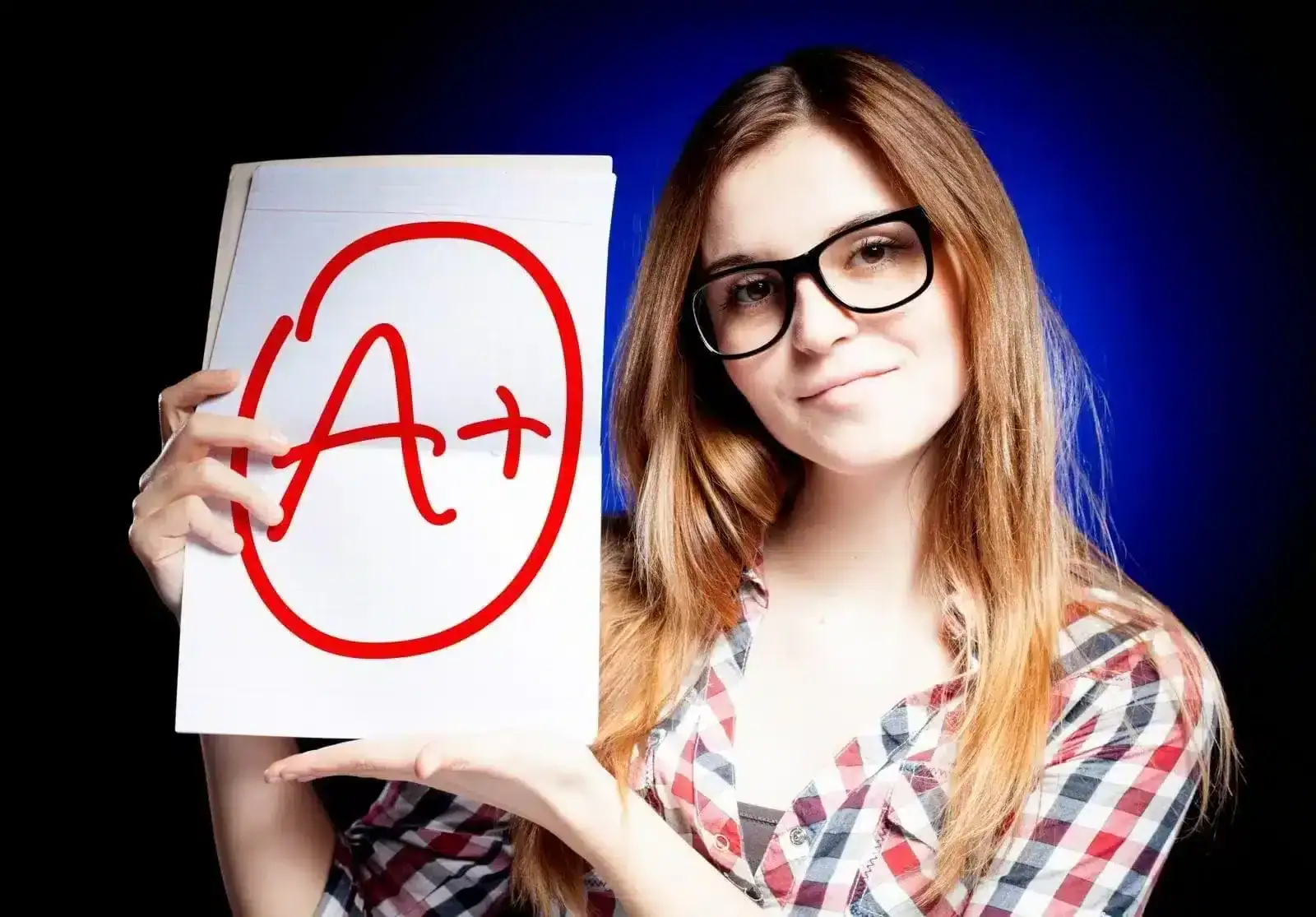 Girl holding A+ paper